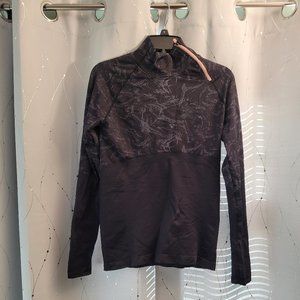 Athletic top with asymmetrical neck zipper